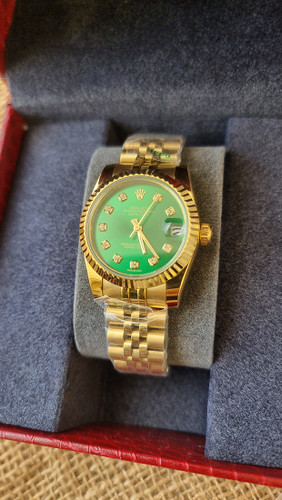 ساعت مچی زنانه رولکس دیت جاست بند طلایی صفحه سبز Date just 32mm